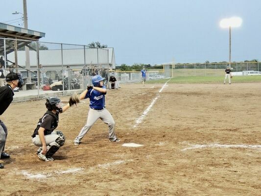 Michael Holtzclaw takes his turn at the plate.