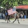 CeJaye Lockridge and ­Stingray led the parade and ­carried the US Flag.